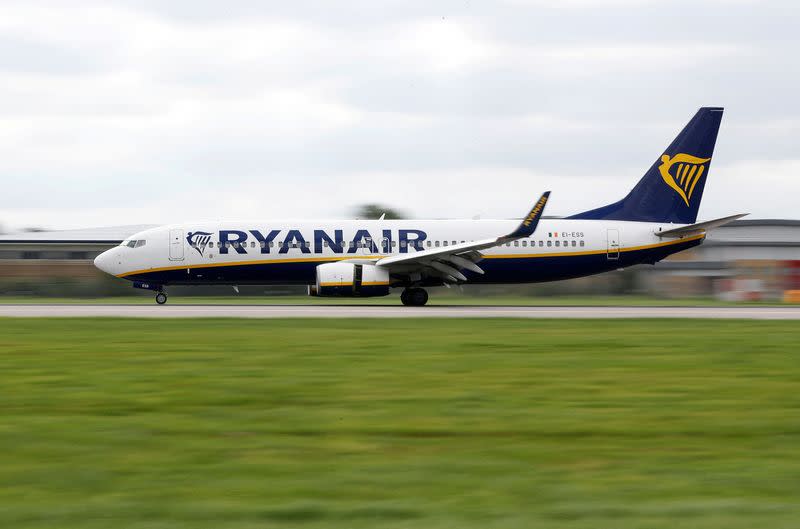 A Ryanair aircraft lands on the southern runway at Gatwick Airport in Crawley