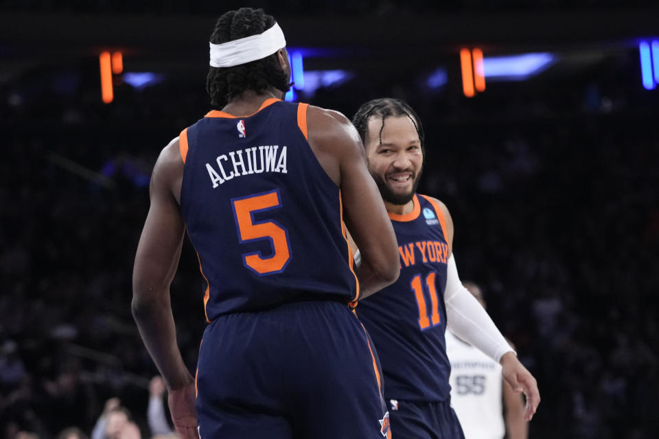 New York Knicks guard Jalen Brunson (11) and forward Precious Achiuwa celebrate after Achiuwa scored during the first half of an NBA basketball game against the Memphis Grizzlies, Tuesday, Feb. 6, 2024, at Madison Square Garden in New York. (AP Photo/Mary Altaffer)
