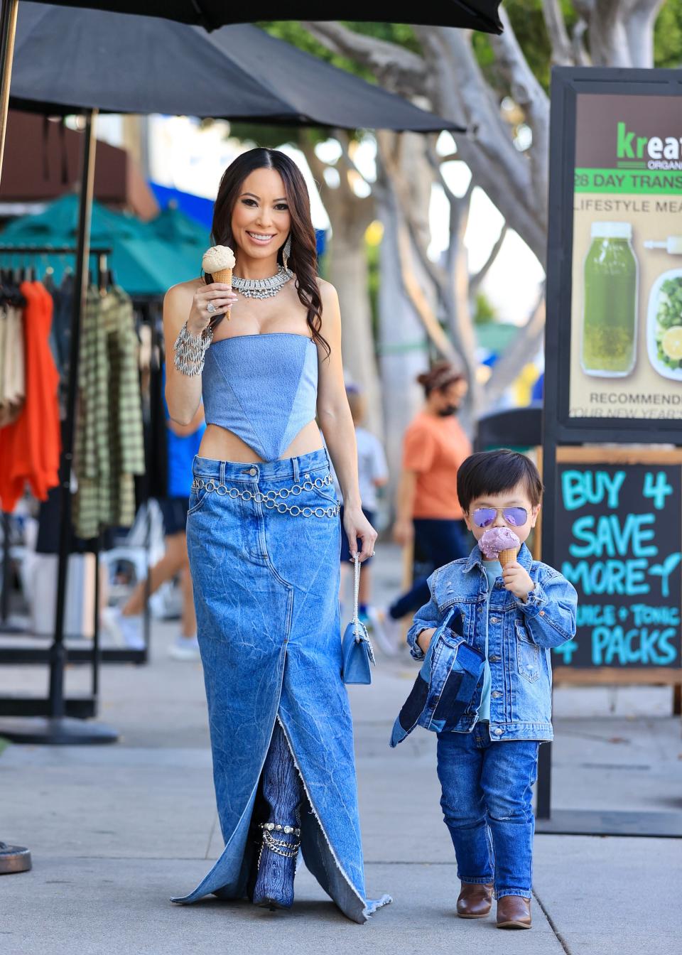 Christine Chiu eating ice cream with her son Baby G. wearing Britney and Justin's denim outfits.