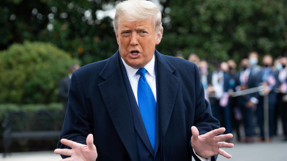 US President Donald Trump speaks to the media as he walks to Marine One prior to departing from the South Lawn of the White House in Washington, DC, October 27, 2020, as he travels on a 3-day campaign trip. (Saul Loeb/AFP via Getty Images)