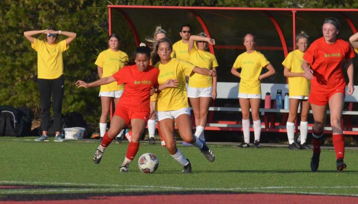 The Holland and Zeeland East girls soccer teams raised awareness for mental health with a Be Nice game.