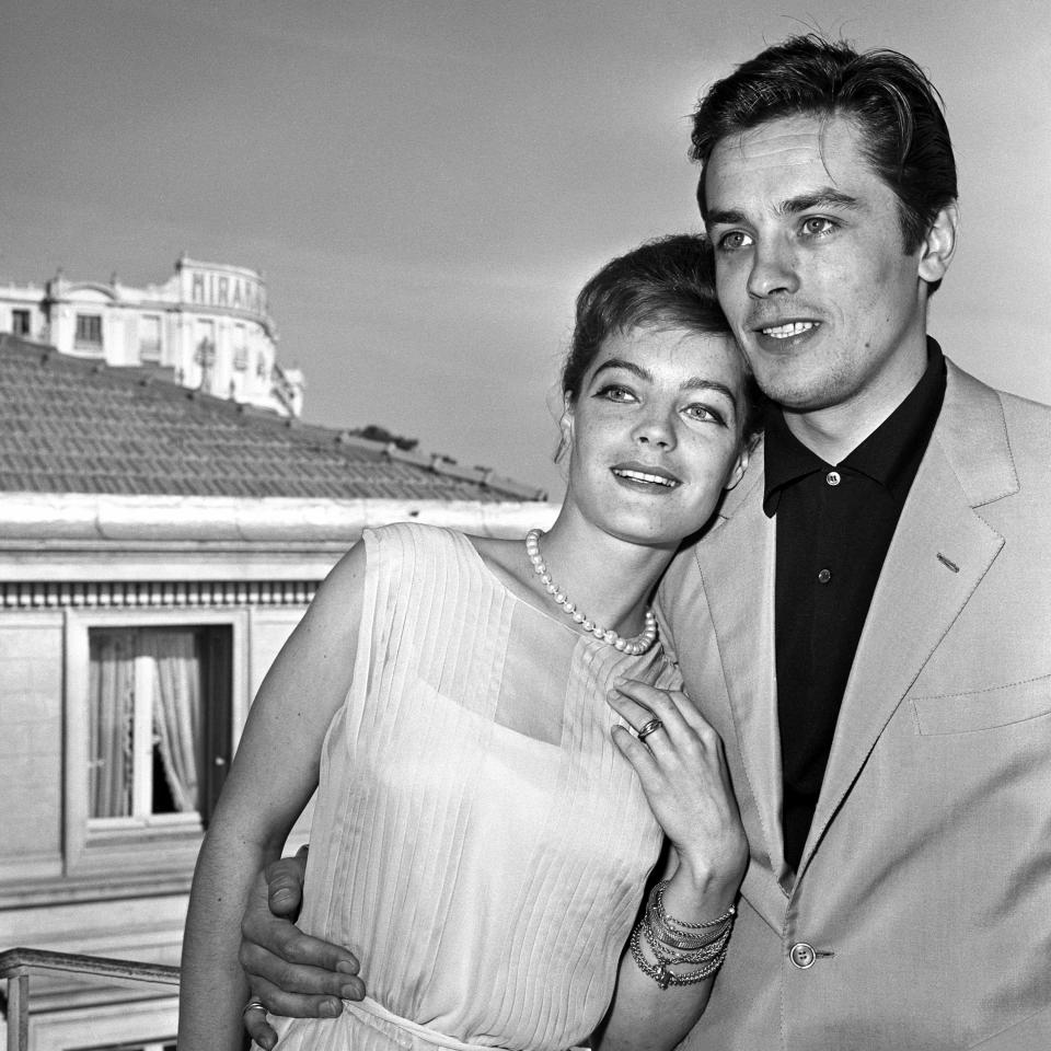 <p>Alain Delon and Romy Schneider, very loving rest on a terrace in Cannes where they are both guests for the Festival   (Photo by Daniel Fallot\INA via Getty Images)</p>
