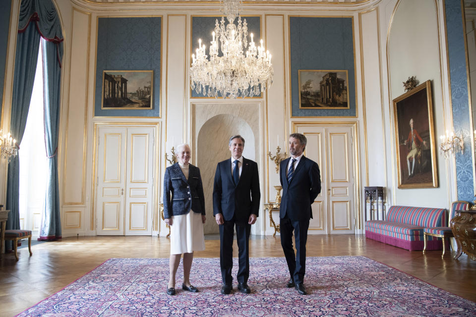 Denmark's Queen Margrethe II, left and Crown Prince Frederik, right, pose for a photo with US Secretary of State Antony Blinken, at Amalienborg Palace in Copenhagen, Denmark, Monday, May 17, 2021. Blinken is in Denmark for talks on climate change, Arctic policy and Russia as calls grow for the Biden administration to take a tougher and more active stance on spiraling Israeli-Palestinian violence. (Saul Loeb/Pool Photo via AP)