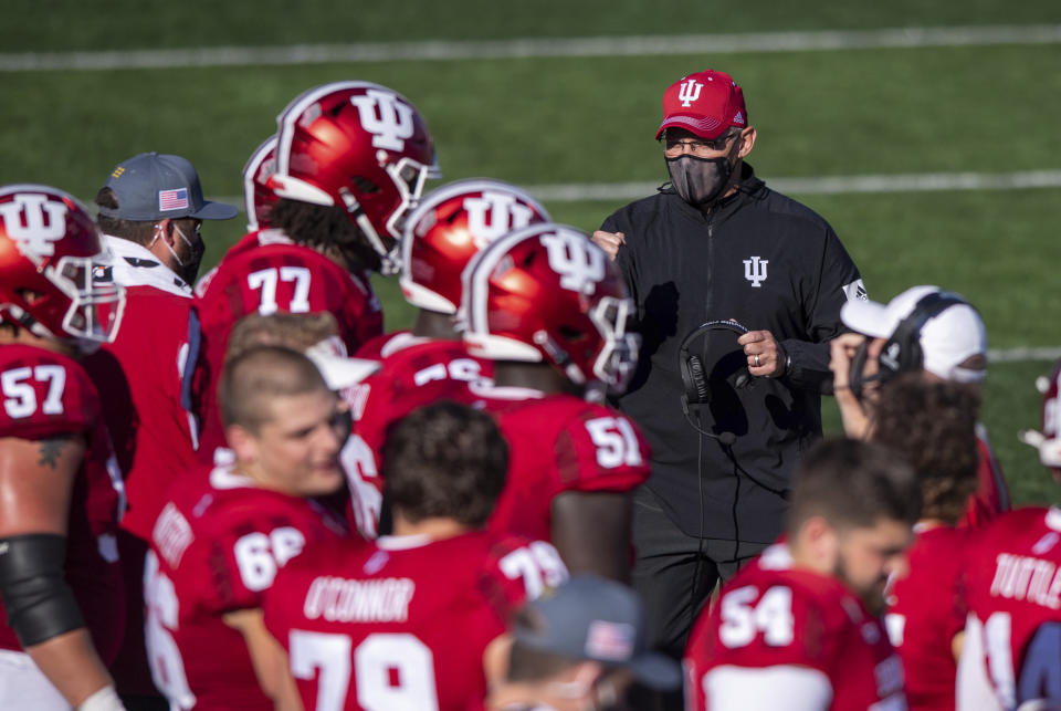 Indiana head coach Tom Allen paces the sideline in front of the team's bench during a break in the second half of an NCAA college football game against Michigan, Saturday, Nov. 7, 2020, in Bloomington, Ind. Indiana won 38-21. (AP Photo/Doug McSchooler)