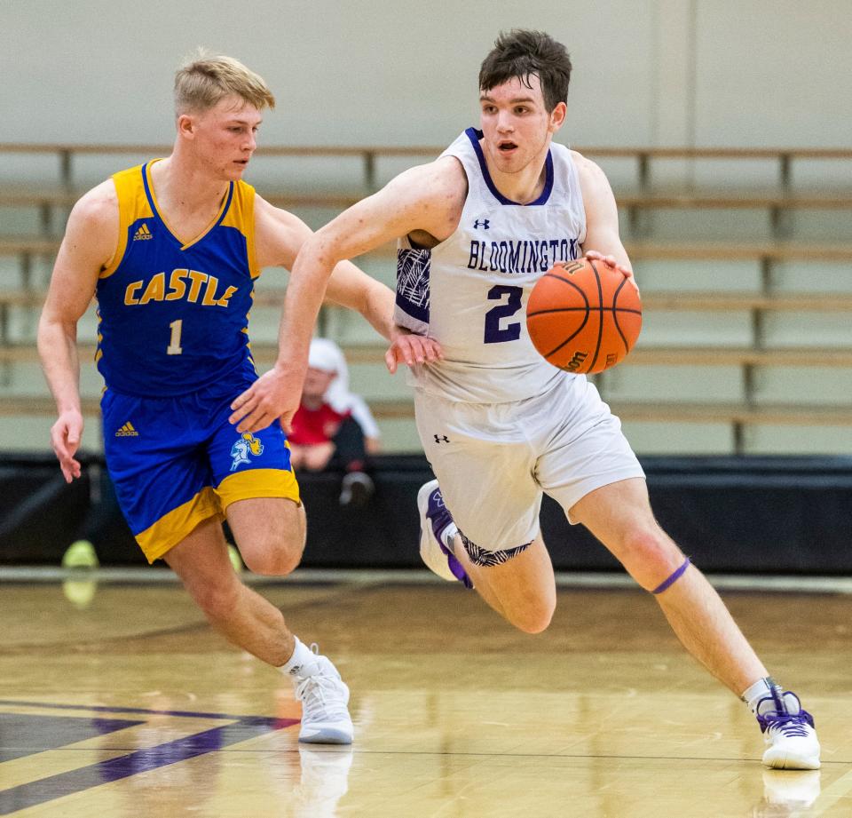South's Zach Sims (21) breaks the Castle press from Brayden Bishop (1) during the Bloomington South versus Castle boys basketball game at Bloomington High School South on Friday, Jan. 20, 2023.