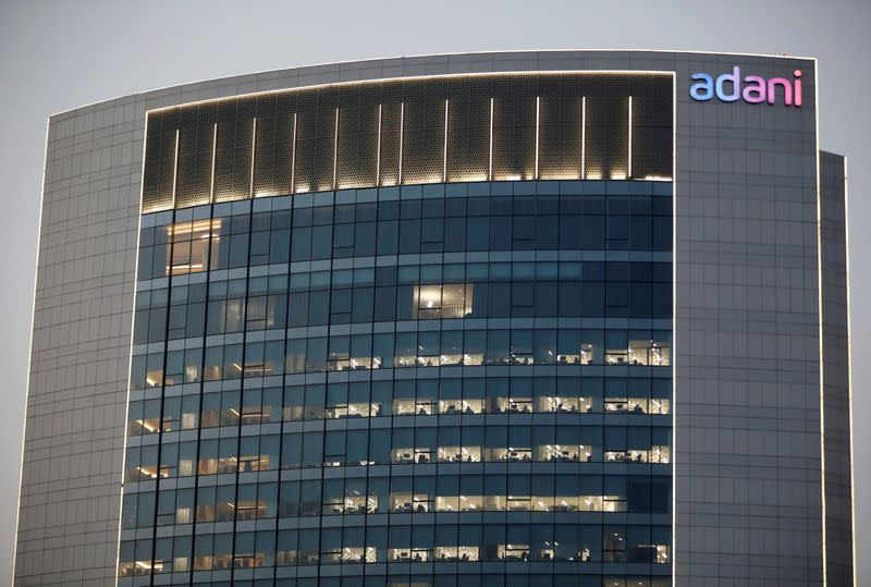 FILE PHOTO: The logo of the Adani Group is seen on the facade of one of its buildings on the outskirts of Ahmedabad