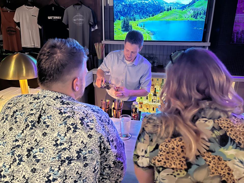 Nate Bowers, a server at VASO, makes his original drink for onlooking judges June 13 during the Dublin Cocktail Classic at The Getaway Brewing Co.