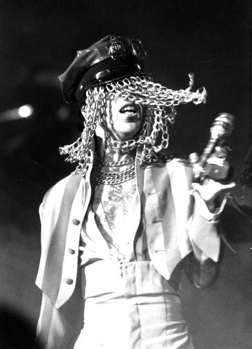 Prince at Radio City Hall, wore a police cap decorated with face concealing chains.