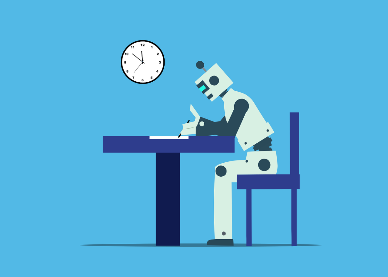  A cartoon of a robot sitting at a desk writing against a blue backdrop. 