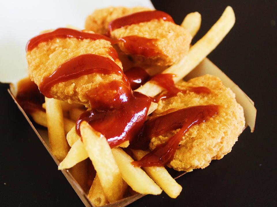 mcdonalds chicken nuggets and fries covered in bbq sauce