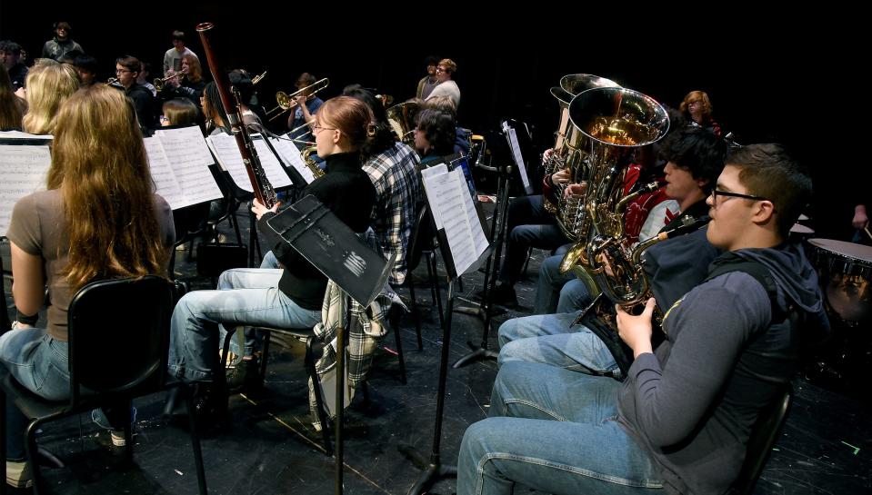 Monroe High School senior Christopher Gallaher, 17, plays his new baritone saxophone with his fourth-hour band class.