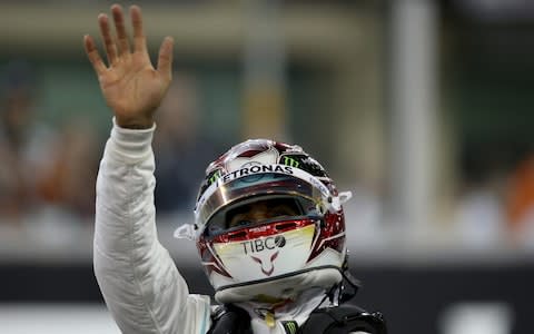 Lewis Hamilton celebrates his pole position - Credit: Getty Images