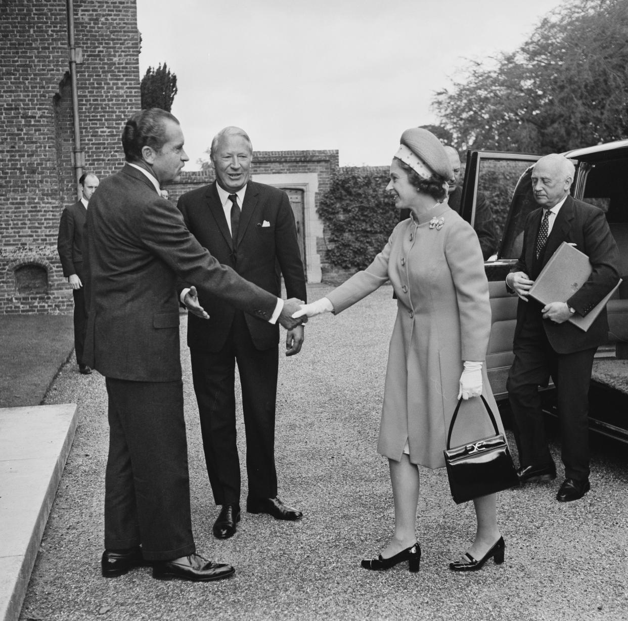 U.S. President Richard Nixon (37th president) and British Prime Minister Edward Heath (c) meet with Queen Elizabeth II for lunch at Chequers, UK, on Oct. 3, 1970.