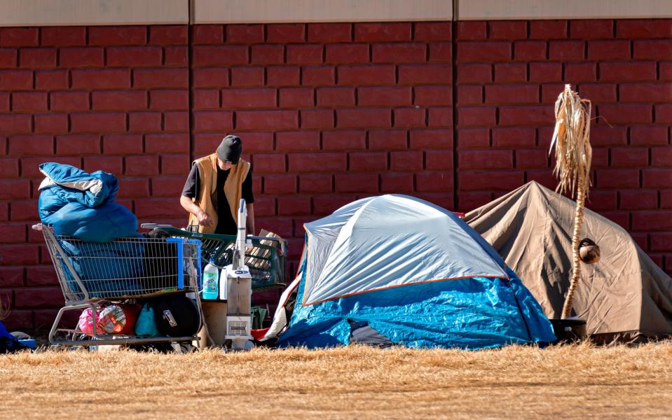 A person is seen at a homeless encampment March 3, 2022, in downtown Oklahoma City.