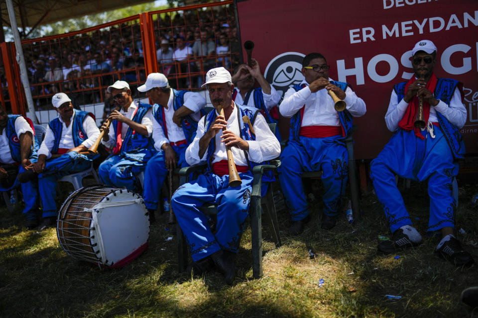 Band members play traditional music during the 661st annual Historic Kirkpinar Oil Wrestling championship, in Edirne, northwestern Turkey, Sunday, July 3, 2022. The festival is part of UNESCO's List of Intangible Cultural Heritages. (AP Photo/Francisco Seco)