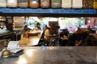 A piece of tape displays a thank you message above a pass-through window at The Sports Bra sports bar on Wednesday, April 24, 2024, in Portland, Ore. (AP Photo/Jenny Kane)