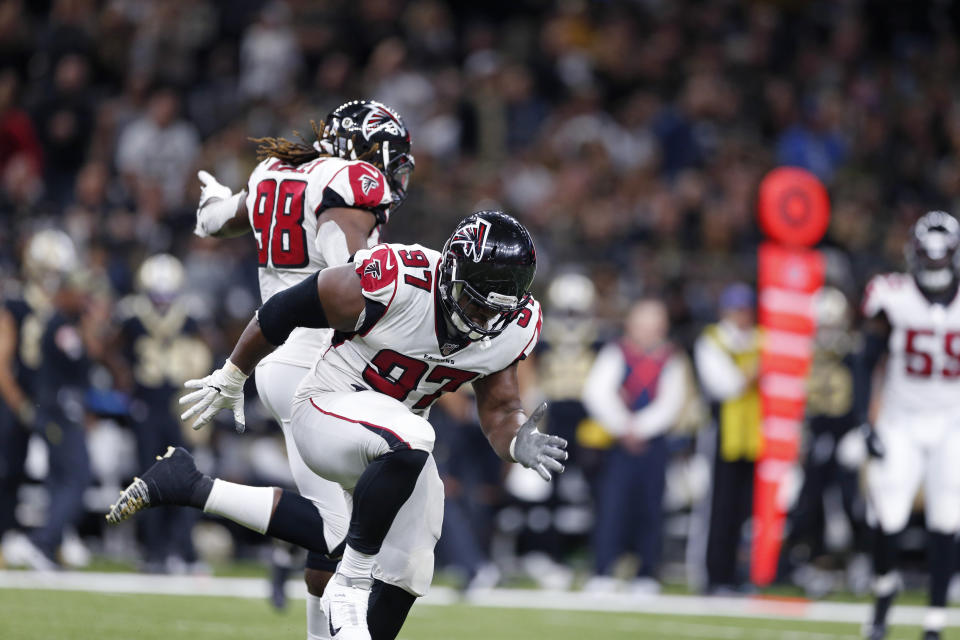 Atlanta Falcons defensive tackle Grady Jarrett (97) celebrates his sack with defensive end Takkarist McKinley (98) in the second half of an NFL football game against the New Orleans Saints in New Orleans, Sunday, Nov. 10, 2019. (AP Photo/Rusty Costanza)
