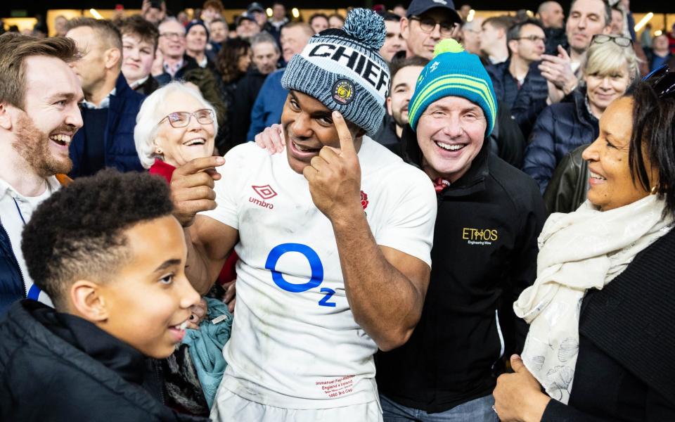 Immanuel Feyi-Waboso celebrates with his family in the crowd after England's Six Nations victory over Ireland