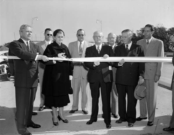 Former state lawmaker John Mathews (front row, second from right) holds a ribbon for a ceremony opening Jacksonville's Mathews Bridge in 1953. (Florida State Archives)