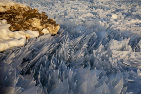 Lake Michigan covered in ice shards in mesmerising new pictures as spring arrives