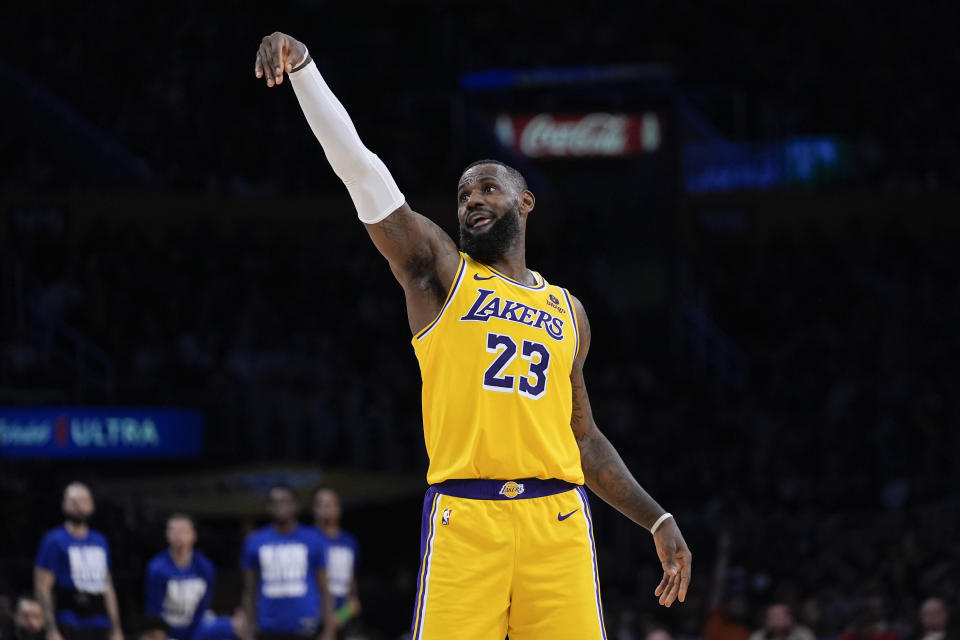 Los Angeles Lakers forward LeBron James watches a shot during the second half of the team's NBA basketball game against the Detroit Pistons, Tuesday, Feb. 13, 2024, in Los Angeles. (AP Photo/Ryan Sun)