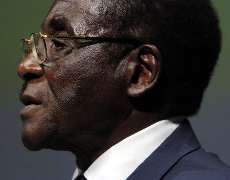 FILE PHOTO - Zimbabwean President Robert Mugabe addressing the inaugural session of the World Summit in Geneva, Switzerland December 10, 2003. REUTERS/Denis Balibouse/File Photo