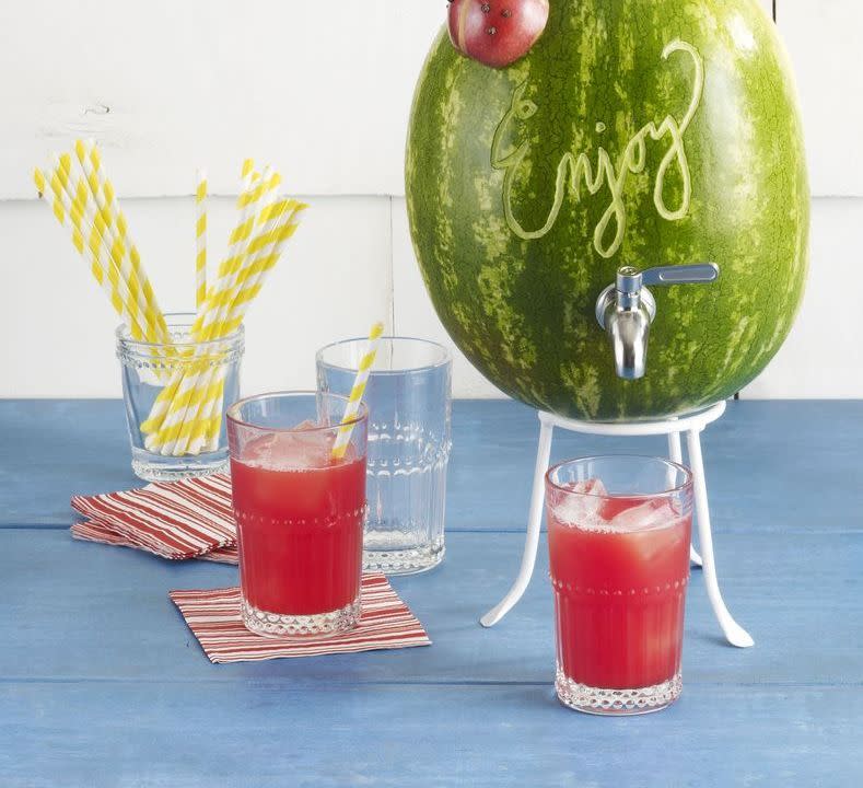 <p>This watermelon drink dispenser works as a tasty spritzer and a fun piece of decor for your 4th of July party. </p><p><strong><em><a href="https://www.womansday.com/food-recipes/a32934439/watermelon-limeade-and-keg-recipe/" rel="nofollow noopener" target="_blank" data-ylk="slk:Get the Watermelon Limeade and Keg recipe;elm:context_link;itc:0;sec:content-canvas" class="link ">Get the Watermelon Limeade and Keg recipe</a>. </em></strong></p>