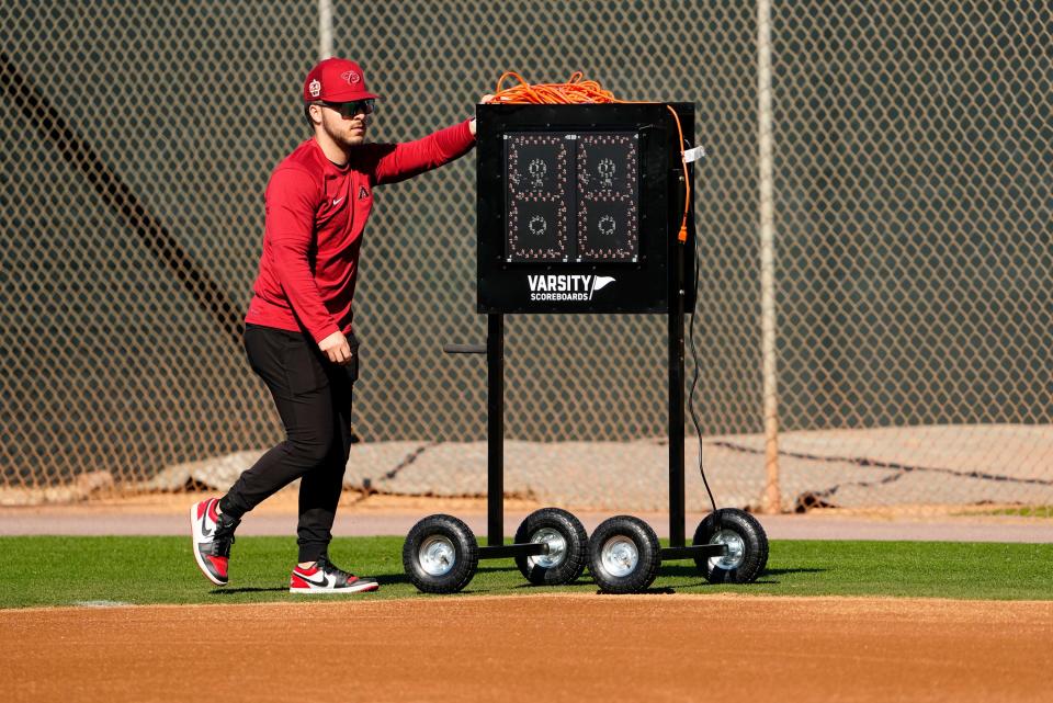 Arizona Diamondbacks wheel out the new pitch clock for live batting practice during spring training workouts on Feb. 20, 2023, at Salt River Fields in Scottsdale, Ariz.