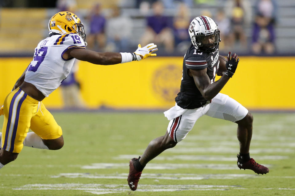 LSU LB Jabril Cox (19) can't quite make the tackle against South Carolina wide receiver Shi Smith on Saturday. (AP Photo/Brett Duke)