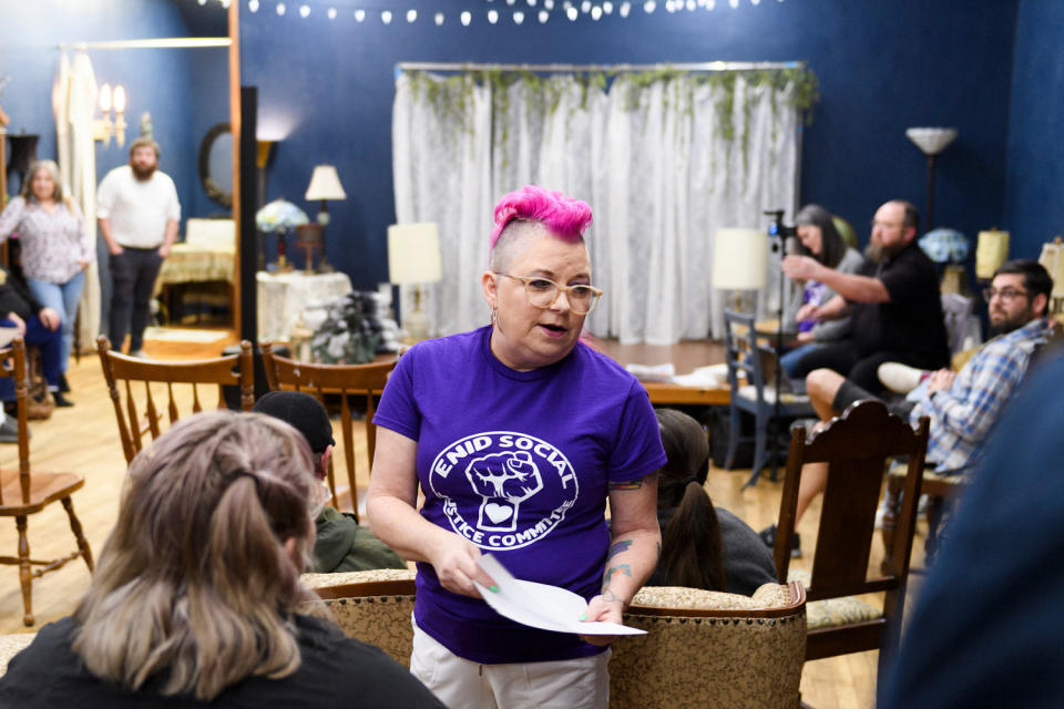 Kristi Balden hands out agendas during a ESJC Social Justice Committee meeting. (Michael Noble Jr. for NBC News)