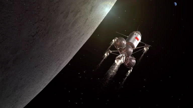 The edge of a gray sphere to the left of a tubular silver spaceship