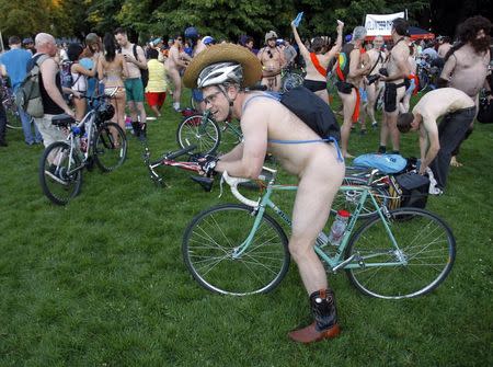 Cyclists prepare to pour into the streets of Portland for the 11th annual World Naked Bike Ride June 7, 2014. REUTERS/Steve Dipaola