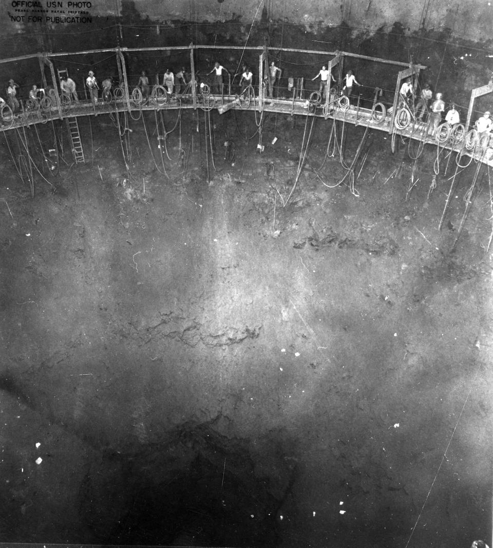 In this photo provided by the U.S. Army Corps of Engineers, this 1942 Navy photo shows miners building one of the 20 fuel tanks of Defense Logistics Agency's Red Hill Underground Fuel Storage Facility at Joint Base Pearl Harbor, Hawaii, which are connected by a miles-long tunnel. A Navy investigation released Thursday, June 30, 2022 revealed that shoddy management and human error caused fuel to leak into Pearl Harbor's tap water last year, poisoning thousands of people and forcing military families to evacuate their homes for hotels. The investigation is the first detailed account of how jet fuel from the Red Hill Bulk Fuel Storage Facility, a massive World War II-era military-fun tank farm in the hills above Pearl Harbor, leaked into a well that supplied water to housing and offices in and around Pearl Harbor. (U.S. Army Corps of Engineers via AP)