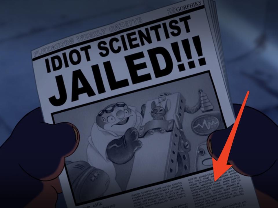 arrow pointing at newspaper in lilo and stitch scene