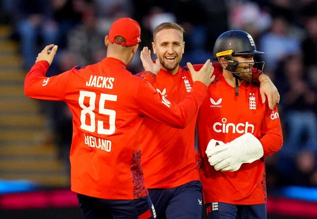 Liam Livingstone, centre, celebrates taking a wicket