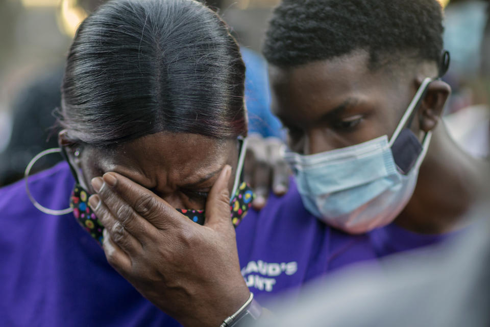 Evon Arbery, Ahmaud Arbery's aunt, is comforted by a family member during Tuesday's memorial walk and candlelight vigil.  (Photo: Stephen B. Morton/AP)