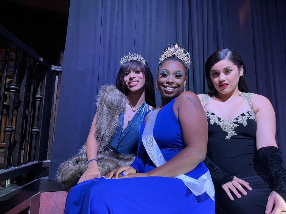 (From left) Aries Antonio, 21, Chelle Tootsie, and Diana Chunga, 23, walk in the face category as prom queens at Stacy's at Melrose on Aug. 4, 2022.
