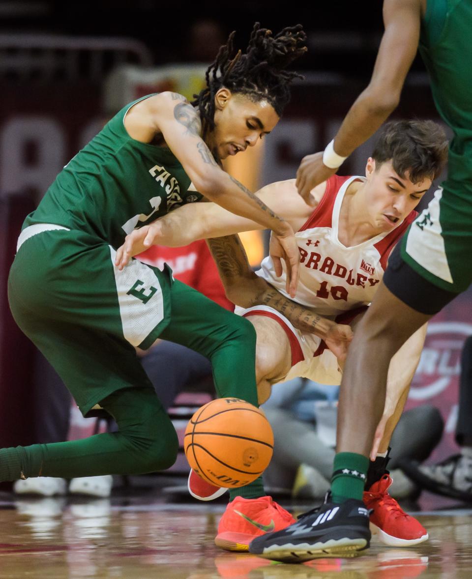 Bradley's Connor Hickman, right, knocks the ball away from Eastern Michigan's Emoni Bates in the first half Tuesday, Nov. 15, 2022 at the Peoria Civic Center. The Braves dismantled the Eagles 89-61.