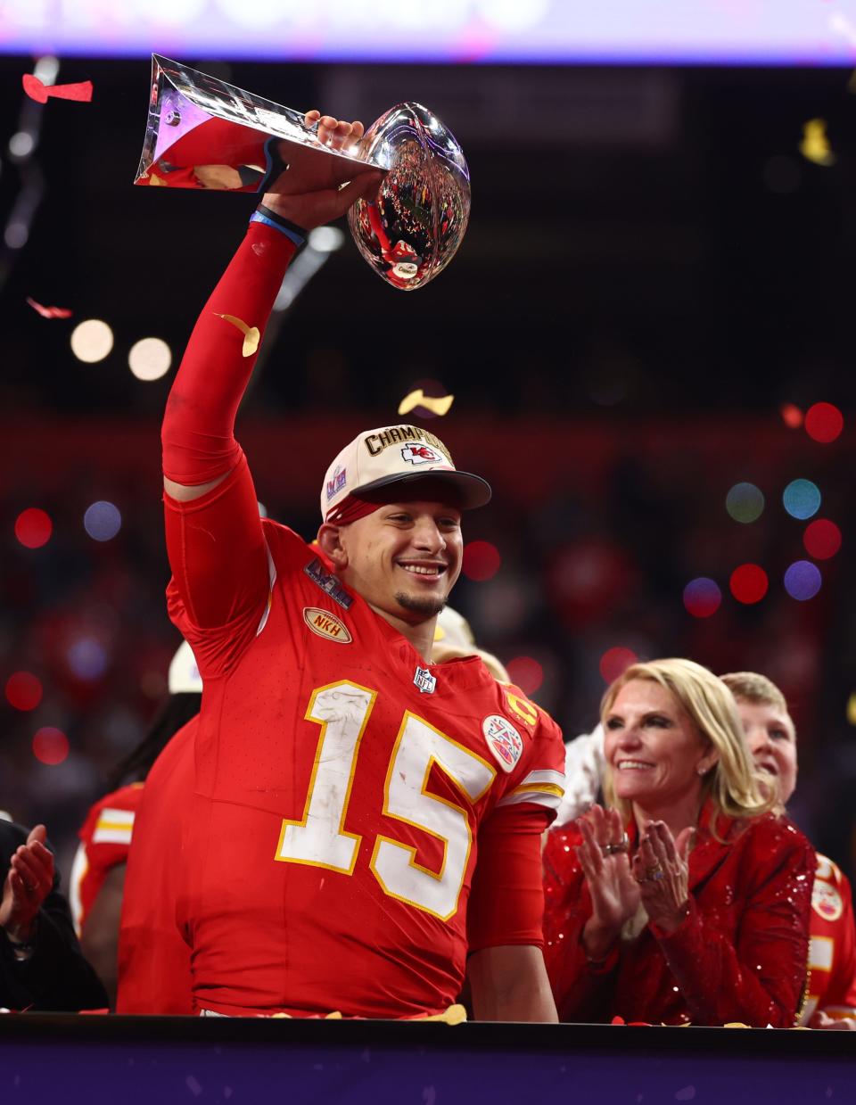 Kansas City Chiefs quarterback Patrick Mahomes hoists the Vince Lombardi Trophy after defeating the San Francisco 49ers in Super Bowl LVIII. Some 49ers fans reacted to the overtime win by smashing their TVs in videos shared on social media.