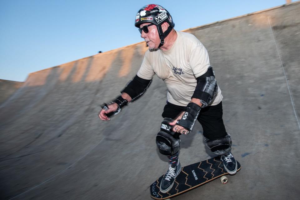 Jimmy Gonzalez, 69, carves a bowl at the Cole Park skatepark on June 16, 2023, in Corpus Christi, Texas. 