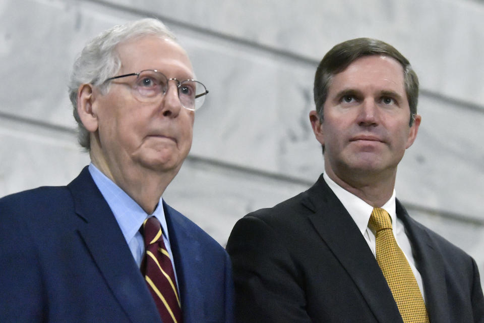 FILE - Senate Minority Leader Mitch McConnell, R-Ky., left, speaks with Kentucky Gov. Andy Beshear during a ceremony in the Rotunda at the Kentucky State Capitol in Frankfort, Ky., Jan. 2, 2024. Kentucky lawmakers on Thursday, March 28 gave final approval to a bill stripping the state's Democratic governor of any role in picking someone to occupy a U.S. Senate seat if a vacancy occurred in the home state of McConnell.(AP Photo/Timothy D. Easley, File)