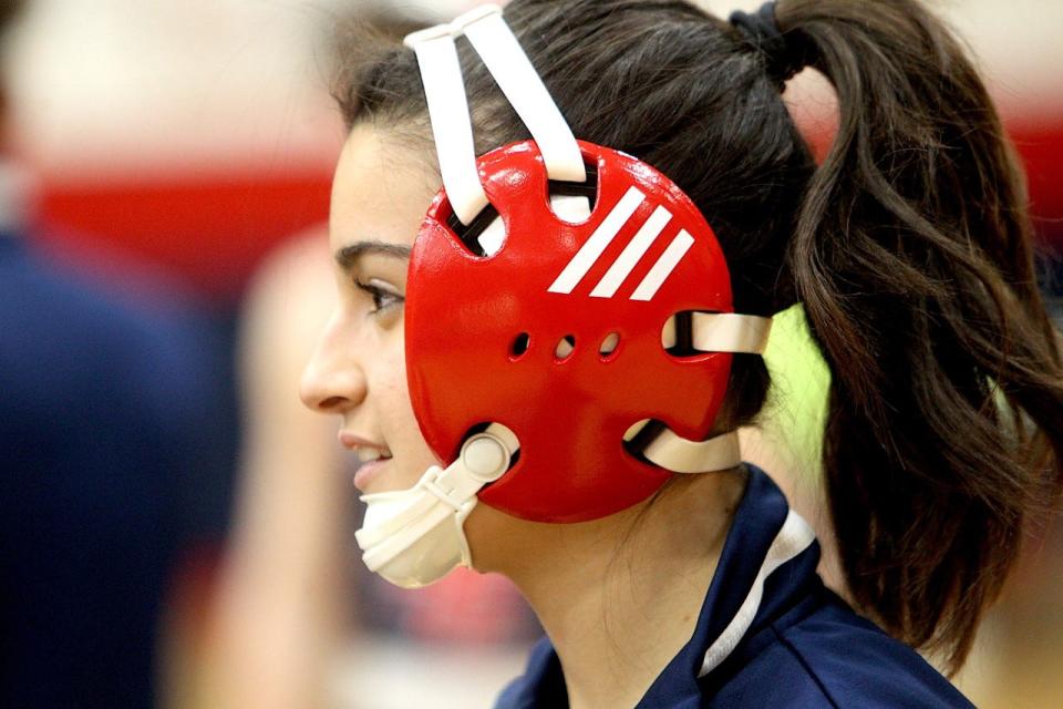 Italian exchange student Alessia Agostini is all smiles prior to a match this season for the BNL wrestling team.