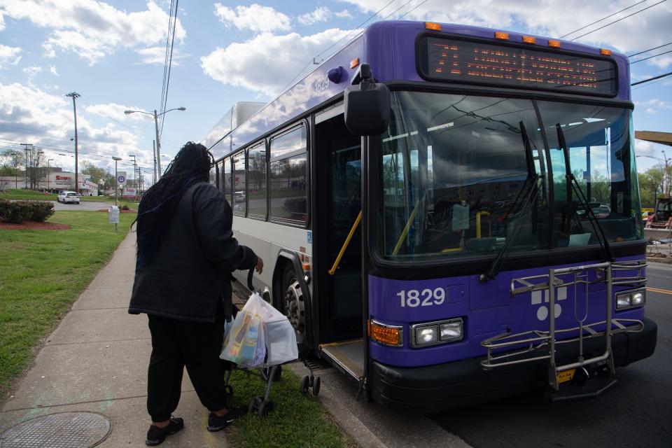 Jameka Huddleston gets on the bus at the temporary bus stop near the future North Nashville Transit Center location at the Clarksville Pike and 26th Avenue North in Nashville, Tenn., Thursday, April 4, 2024.