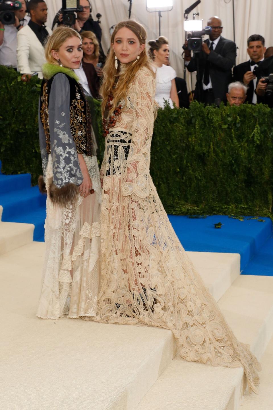 Mary-Kate and Ashley Olsen bring out their boho roots in lacy vintage-style gowns at the Met Gala