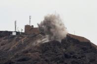 Smoke billows from a hilltop during clashes between fighters from Yemen's southern separatist movement and forces loyal to the Saudi-backed president in Aden on January 28, 2018