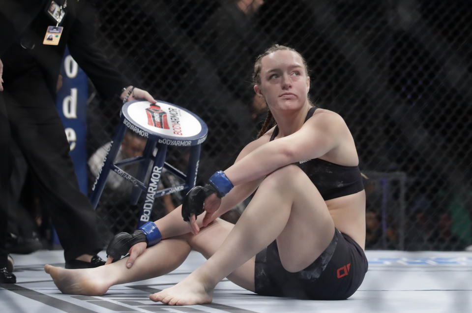 Aspen Ladd reacts after being defeated by Germaine de Randamie during a women's bantamweight mixed martial arts bout at UFC Fight Night in Sacramento, Calif., Saturday, July 13, 2019. De Randamie won by first-round knockout. (AP Photo/Jeff Chiu)