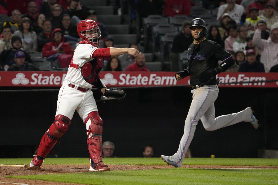Angels catcher Matt Thaiss' foot was a few inches from an inning-ending double play. Home plate umpire C.B. Bucknor missed it — but the replay booth didn't. (AP Photo/Mark J. Terrill)