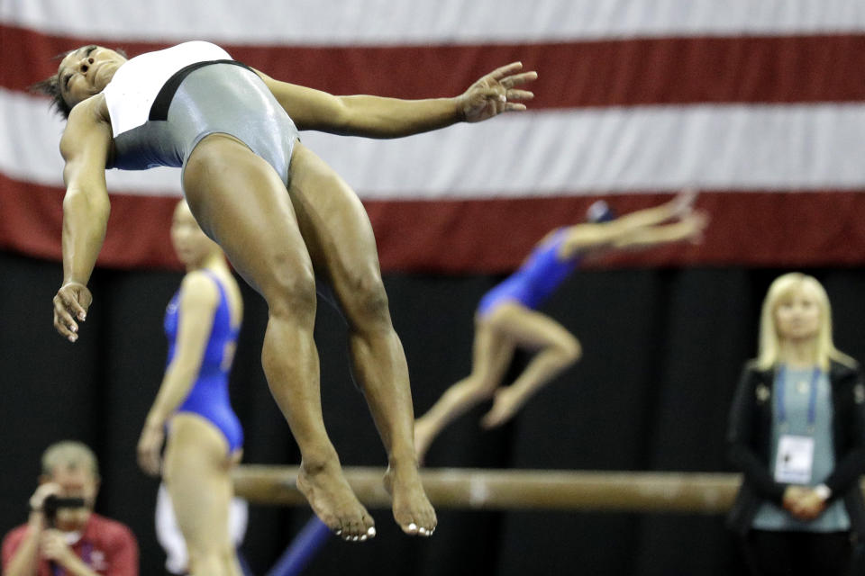 Simone Biles works on the vault during practice for the U.S. Gymnastics Championships Wednesday, Aug. 7, 2019, in Kansas City, Mo. (AP Photo/Charlie Riedel)