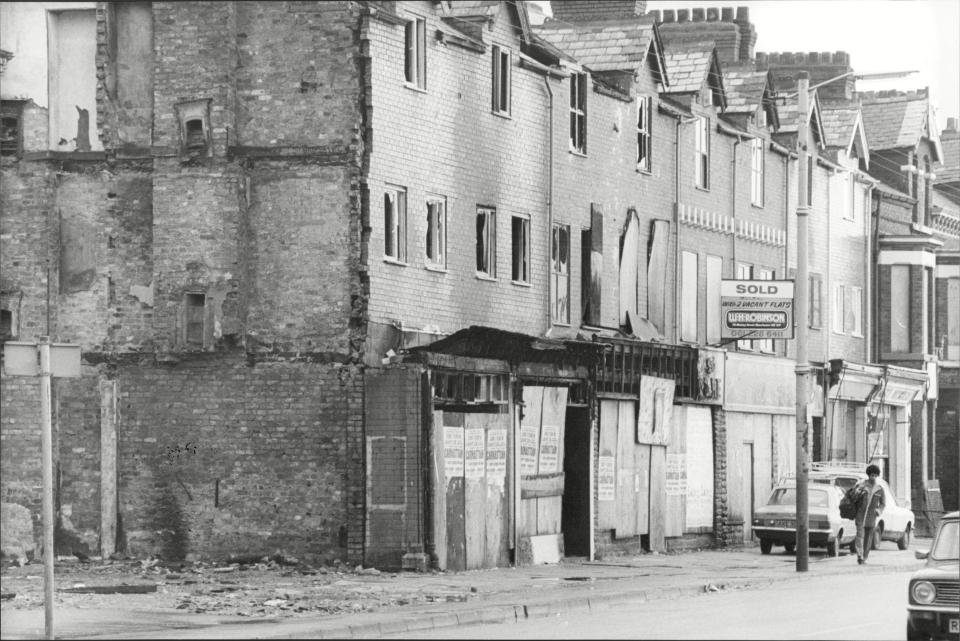 Shuttered shops after the Moss Side riots, 1981.