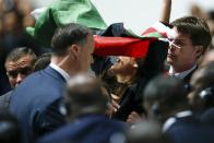 Security officers block a pro-Palestine protestor at the 65th FIFA Congress in Zurich, Switzerland, May 29, 2015. The embattled head of world soccer, FIFA President Sepp Blatter, is expected to be re-elected on Friday despite growing calls for his resignation amid a corruption scandal that has engulfed the sport's governing body. REUTERS/Arnd Wiegmann